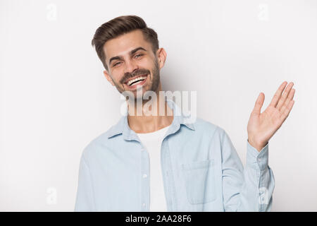 Happy client waving hand in greeting gesture Stock Photo