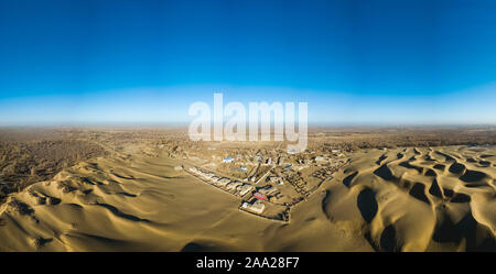 (191119) -- YUTIAN, Nov. 19, 2019 (Xinhua) -- An aerial panoramic photo taken on Nov. 13, 2019 shows a view of an oasis by the Keriya river in northwest China's Xinjiang Uygur Autonomous Region. The Keriya river originates from the Kunlun mountains, flows north through Yutian County in Xinjiang, and ends in the Taklimakan desert. (Xinhua/Shen Bohan) Stock Photo