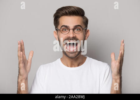 Close up portrait with overly rejoicing handsome bearded man. Stock Photo