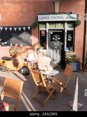 A teddy bear sitting outside the Coffee Central cafe in Whitley Bay Metro station, North East, England, UK Stock Photo