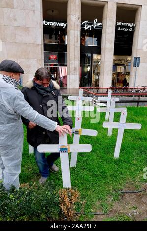 Flash mob by the street artist Cristina Donati Meyer with the youth of the Palestinian association of Italy in Piazza San Babila where white crosses are planted against the massacre of children in Gaza Editorial Usage Only Stock Photo