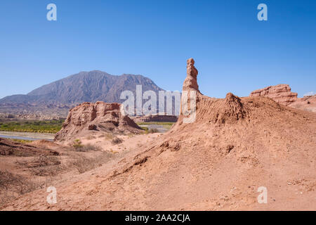 Scenic view of typical geological formations at the Quebrada de las Conchas with the River Las Conchas in the background, Cafayate, Argentina Stock Photo