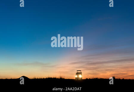 Game drive in Maasai Mara (Kenya) early one morning as the planet Venus rises in the east before the sun breakes the horizon. Stock Photo