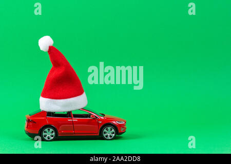 Small car with Santa hat on the roof 