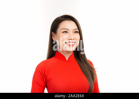 Vietnamese woman in red ao dai dress smile. Happy lunar new year concept Stock Photo