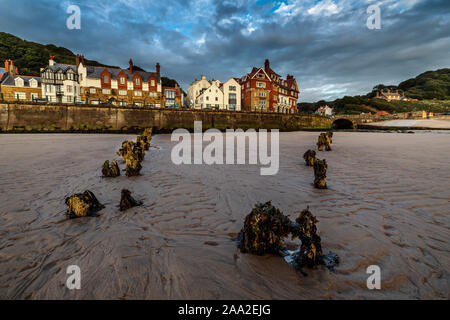 Early morning view from the beach, with remains of groynes, of the seaside village of Sandsend, near Whitby North Yorkshire England UK Stock Photo