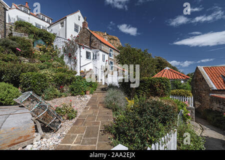 Picturesque cottages and gardens in Runswick Bay, North Yorkshire, North York Moors National Park, England, UK. Stock Photo