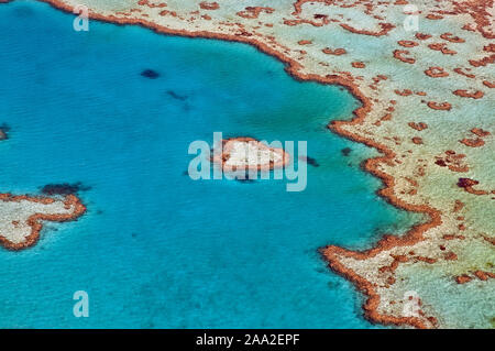 Part of Hardy Reef in the central GBR-section off Whitsunday Island as seen from the air. In the centre is the small patch-reef known as 'Heart Reef' Stock Photo