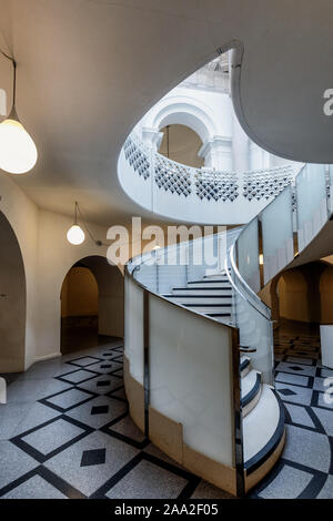 An elegant spiral staircase at Tate Britain, Millbank, London, UK