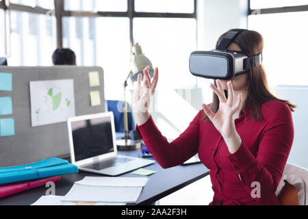 Business professional at work using VR Stock Photo