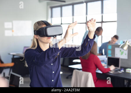 Business professional at work using VR Stock Photo