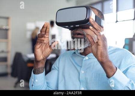 Business professional at work using VR Stock Photo