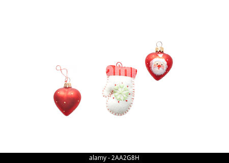 Handmade Christmas ornament toys. for New Year's tree: hearts, felt mittens isolated on a white background. Stock Photo