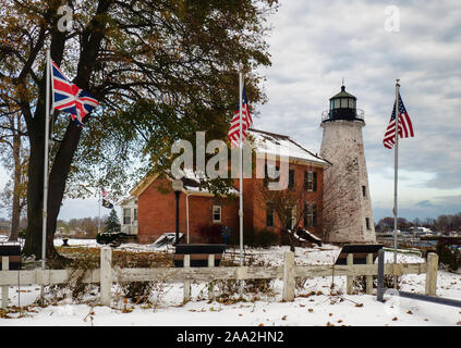 Charlotte, New York, USA. November 15, 2019. View of the Charlotte-Genesee Lighthouse, circa 1822, near the shores of Lake Ontario with British and Am Stock Photo