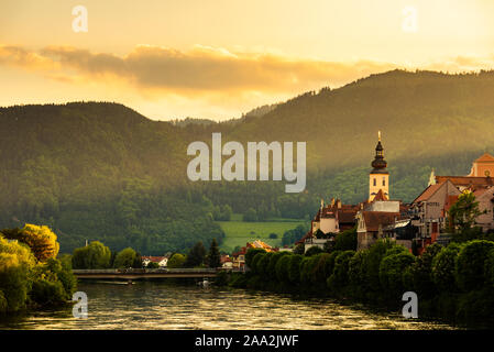 Austrian village Frohnleiten at Mur river in Styrian region. Landscape of town during sunset Stock Photo