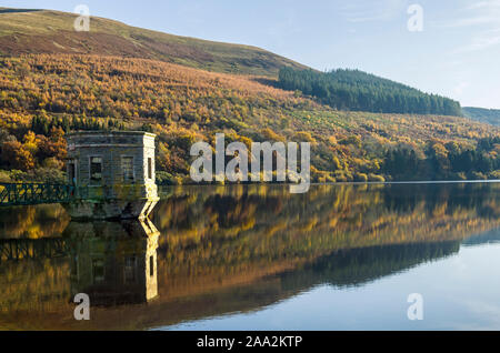 Autumn Reflections on the Talybont Reservoir in the Brecon Beacons National Park in Powys South Wales. Autumn has arrived.