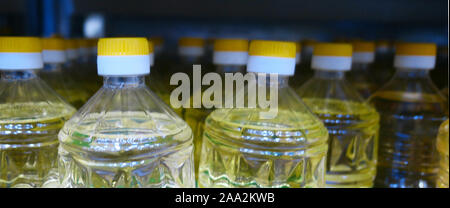 Bottles of cooking oil in a supermarket Stock Photo