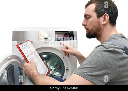 repair washing machine by a service technician at customer's home // insulated on white background Stock Photo