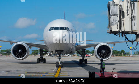 Supervisor meets passenger airplane at the airport Stock Photo