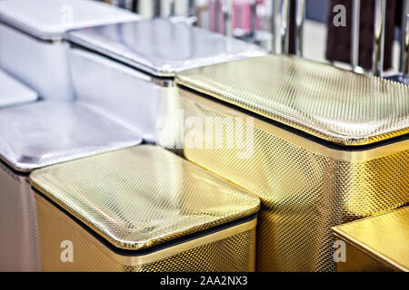 empty plastic laundry basket with lid and selective focus. Row of new laundry baskets without clothes. Box for organizing cloths or items Stock Photo