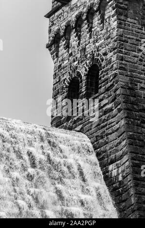 Overflow water next to the Tower on Derwent Dam Stock Photo