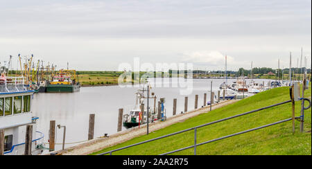 port scenery in Greetsiel, a idyllic village located in East Frisia, Northern Germany Stock Photo