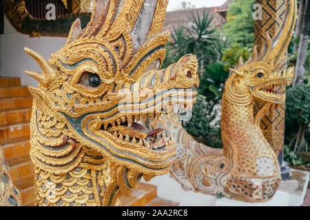 Dragon guard statue at the thai buddhist temple entrance Stock Photo