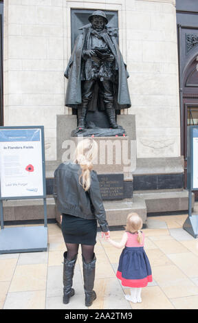 Statue of the 'Unknown Soldier' on platform 1 at Paddington Station in London. Various celebrities as well as anonymous persons have contributed to a book  called  'Letter to an Unknown Soldier', inspired by this bronze statue of a soldier holding a letter. Stock Photo