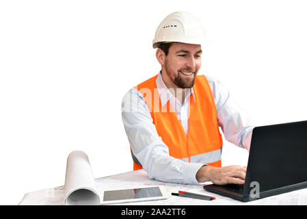 Architect / engineer at his desk planning the construction of a house - white background Stock Photo