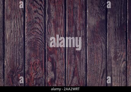 Wooden background texture. Creatively painted dark brown boards. Stock Photo