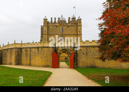 Red painted wooden gates leading into the Little Castle at Bolsover Castle, Derbyshire, England, UK Stock Photo