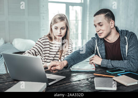 Nice young students preparing together for exam Stock Photo