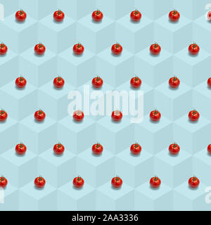 Tomato vegetable background, Isometric pattern photographed, Tomato's on a light blue background, wrapping paper, postcard, wallpaper, Minimal food co Stock Photo