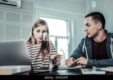 Nice smart people preparing for classes together Stock Photo