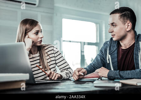 Pleasant nice couple studying at home together Stock Photo