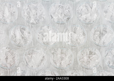 Plastic bubble wrap texture background, uneven lightning Stock Photo