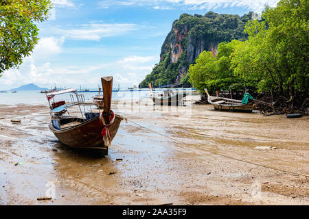 Big low tide on the Railay Beach in a beautiful sunny day with white clouds. Krabi, Thailand Stock Photo