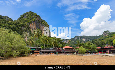 Big low tide on the Railay Beach in a beautiful sunny day with white clouds. Krabi, Thailand Stock Photo