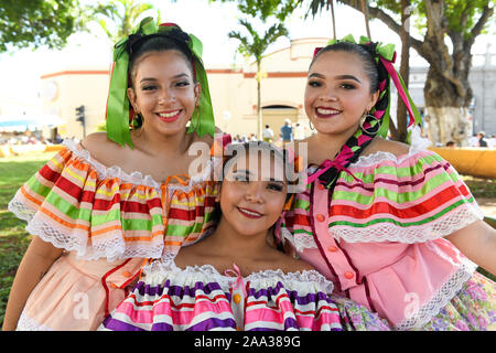 Young Mexican women in traditional costumes on Revolution Day, Merida Stock Photo