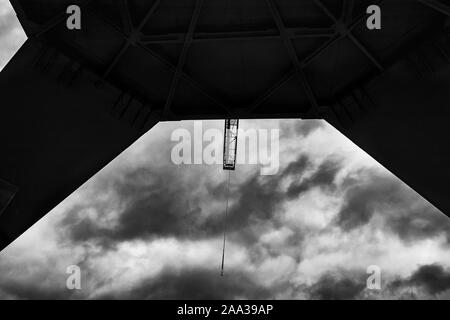 NDSM Crane, old crane, dark clouds, dramatic sky, Black and white picture, postcard, abstract background, wallpaper, old industry, Amsterdam Noord Stock Photo