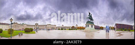 Panoramic view of Heldenplatz at the Hofburg palace in Vienna on a rainy day with dark clouds. Stock Photo