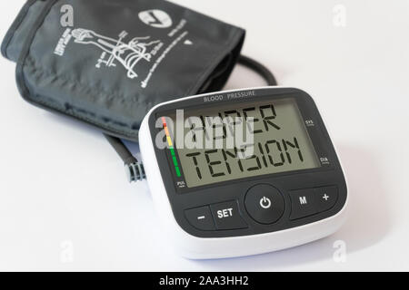 Blood pressure arm band with hypertension text. Hypertension concept Stock Photo