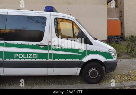 Berlin, Germany. 19th Nov, 2019. A police vehicle is standing in front of the house of a 26-year-old man who has been arrested on suspicion of terrorism. They say the Syrian bought chemicals to make bombs. (on 'Bought chemicals for bomb-making - Terror suspect arrested') Credit: Paul Zinken/dpa/Alamy Live News Stock Photo