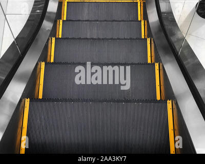 Excavator in the supermarket, view from the top. Mechanical ladder with electric drive. Urban lifestyle. Stock Photo