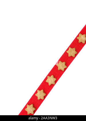 Christmas cookies on red ribbon as Christmas background. Top view. Stock Photo
