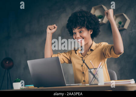 Low below angle view photo of cheerful excited executive having read reports of her workers ecstatic about results of annual preparation for corporate Stock Photo