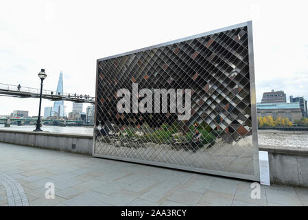 London, UK.  19 November 2019.  'Liminal' by Wolfgang Buttress, a sculptural installation comprising mirror, satin and matt aluminium panels that alter the viewer's perception and view of the River Thames.  The installation is the result of a design competition by the London Festival of Architecture and the City of London Corporation and is sited on the north bank of the Thames opposite Tate Modern.  Credit: Stephen Chung / Alamy Live News Stock Photo