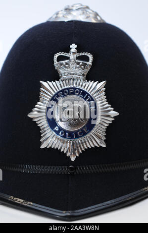 Traditional real British Metropolitan Police Hat / Helmet on white background. Photography by Danny Fitzpatrick www.dfphotography.co.uk danny@dfphoto Stock Photo