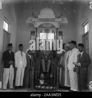When King Bhumibol Adulyadej Visited the Muslim people in Nakhon Si Thammarat province on March 15, 1959 or 60 years ago, and the King sat on the Minbar inside the mosque. Still very much rejoicing to the Muslim people of Nakhon Si Thammarat province and is considered the only sitting on the Minbar in Thailand Stock Photo