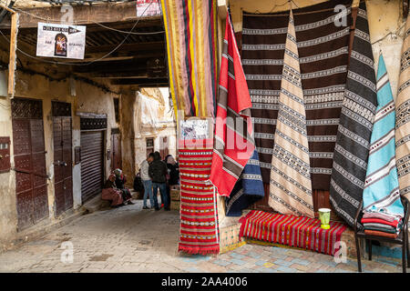 Fez, Morocco. November 9, 2019.  the shops that display the fabrics in the streets of the medina Stock Photo